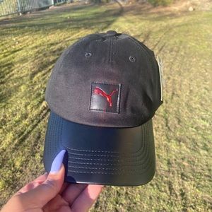 PUMA black hat with red emblem , NWT